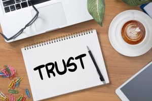 Trust written on white paper