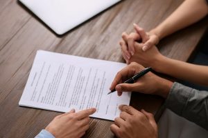 Judge's hammer, pen and book with the words Irrevocable Trust vs Revocable Trust