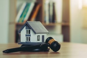 Judge's gavel and model of home