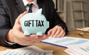 Gift tax is shown using a text on the piggy bank 