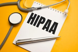 HIPAA document on table with stethoscope, representing medical privacy and compliance. 