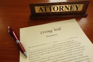 Close-up of a living will form with pen and lawyer's nameplate
