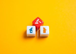 Illustration of a house being divided in half, symbolizing court-ordered division of real estate due to divorce, inheritance, or ownership disputes.