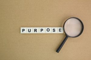 Alphabet letters arranged to spell the word 'Purpose,' symbolizing vision, intention, or the reason behind something.