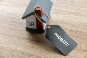 Probate Process Concept with House Model and Legal Tag for Estate Settlement