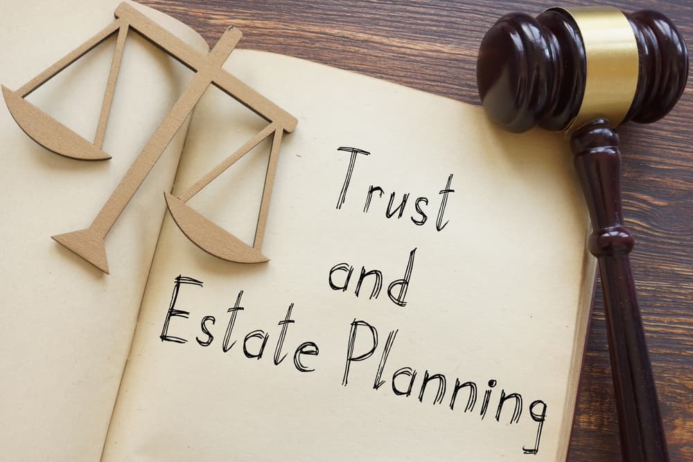 Trust and Estate Planning is shown on a photo using the text and gavel