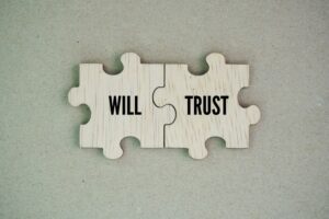Wooden puzzle with the words will and trust.