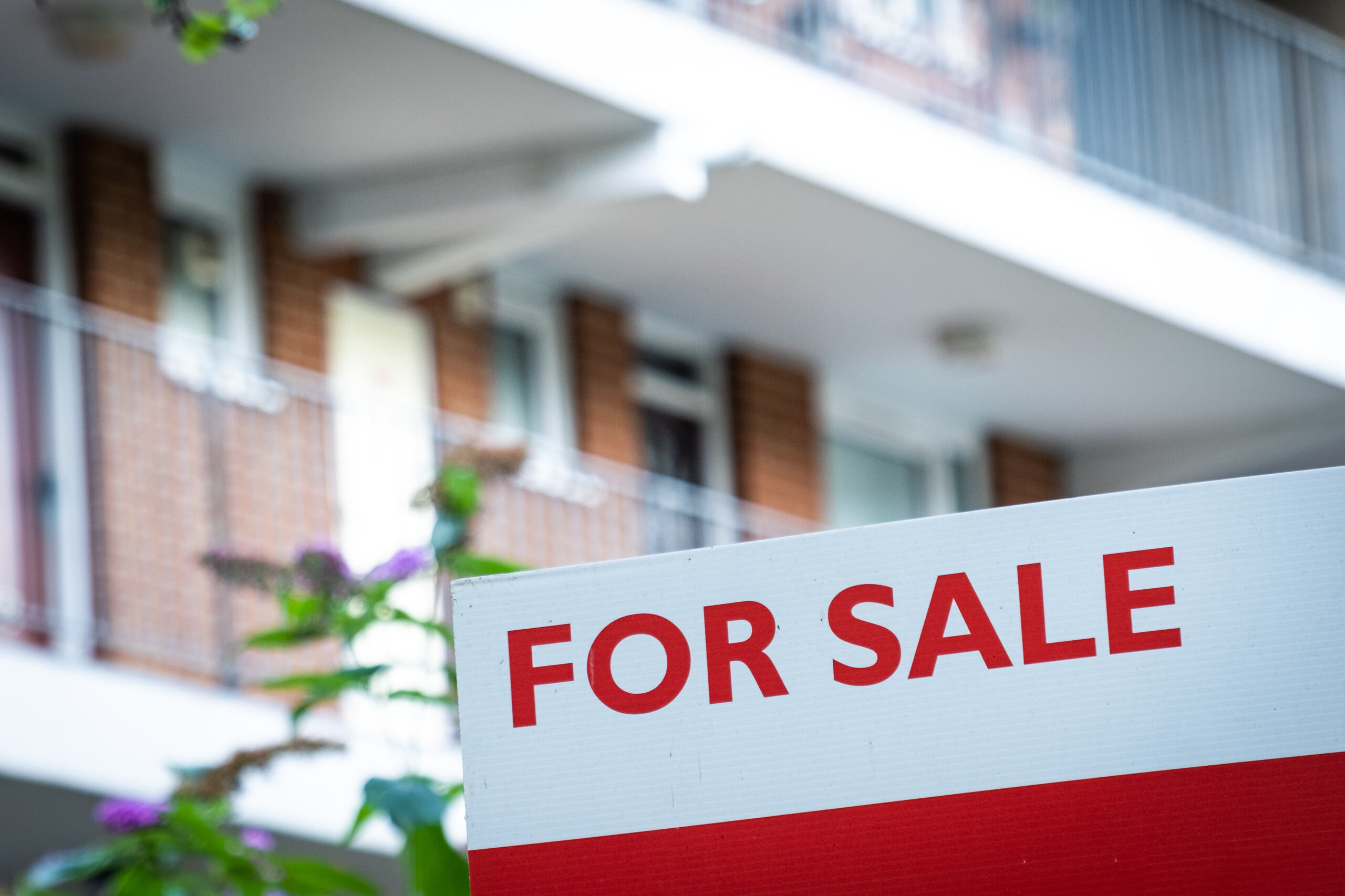 A "For Sale" sign in front of a Florida residential property, representing the outcome of a partition action to force the sale of inherited real estate.