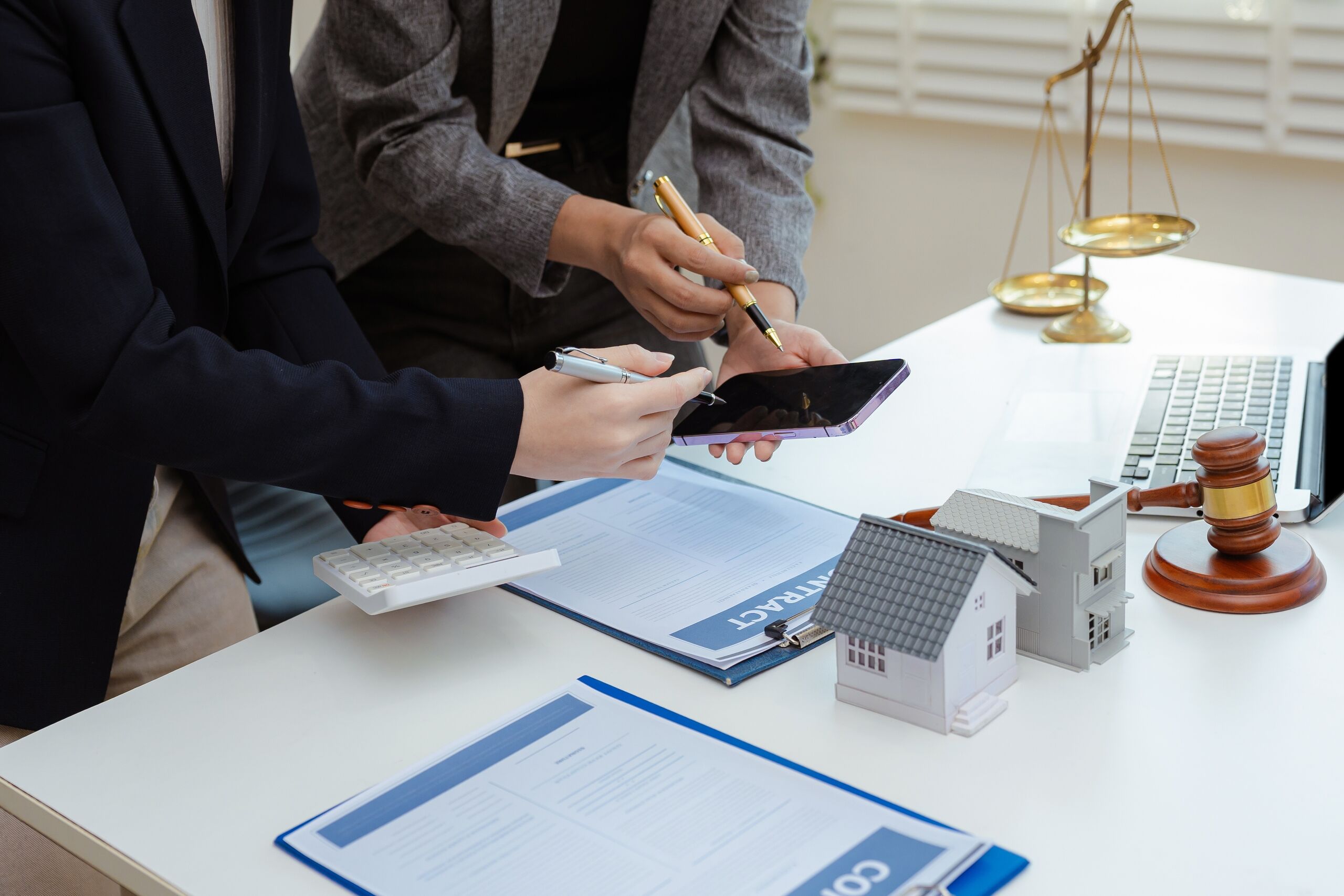 Florida legal professionals reviewing a partition agreement and buyout options for heirs inheriting property with siblings.